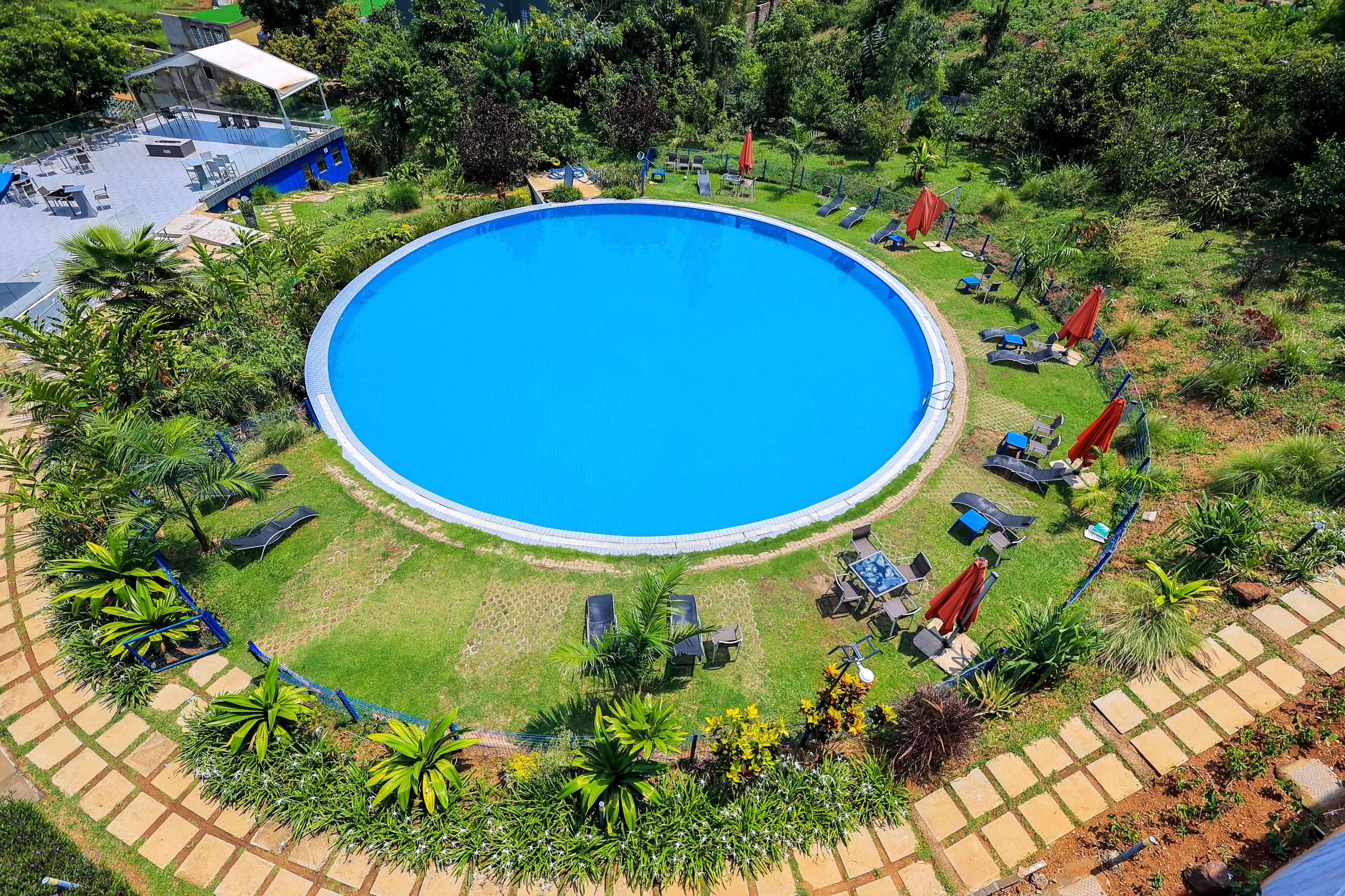Outdoor swimming pool at Aquarius Kigo Resort with poolside loungers